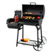 Tepro Biloxi Offset BBQ Smoker with meat and vegetables grilling on it and condiments resting on the side table