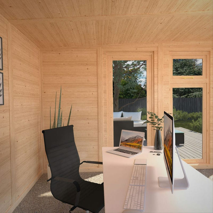 Inside of Mercia Harlow 6m x 4m insulated garden office with sofa and plants