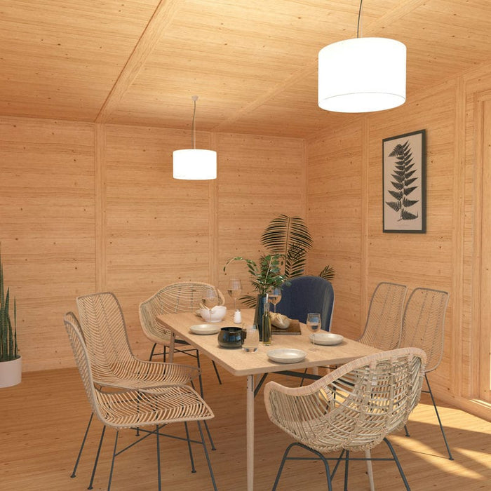 Inside of Mercia Harlow 6m x 4m insulated garden room with dining table and cutlery