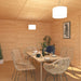 Inside of Mercia Harlow 6m x 4m insulated garden room with dining table and cutlery